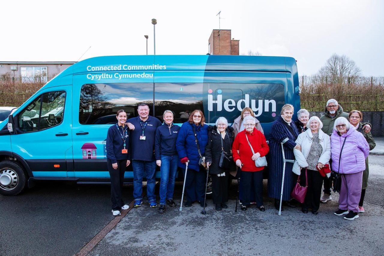 Hedyn colleagues and residents stand in front of the Hedyn bus.